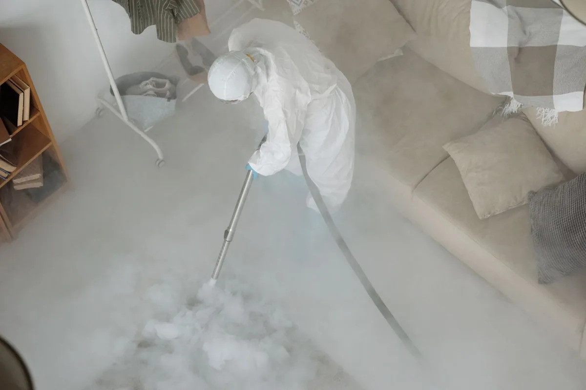Biohazard cleanup technician in protective equipment, Shelter Island, NY
